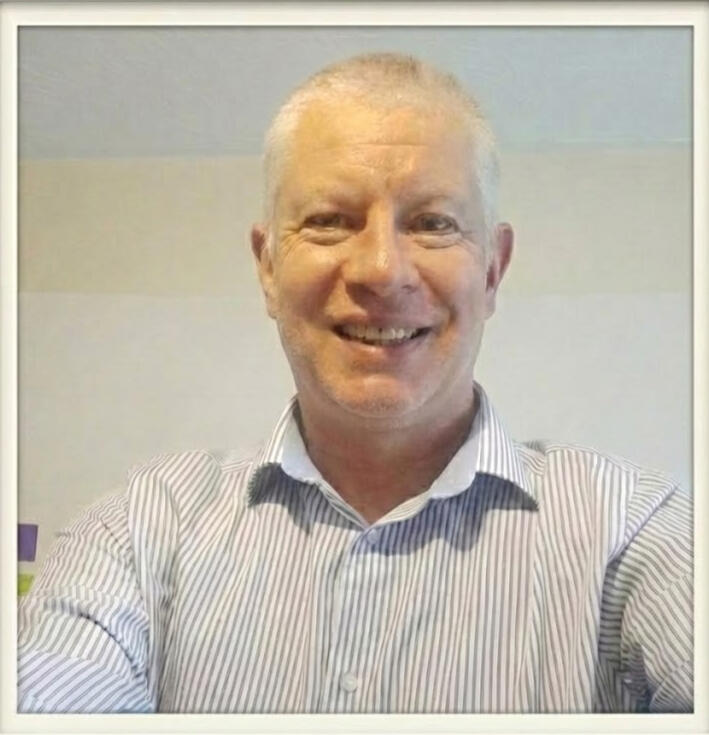 Intercept_Mentors2 Headshot of the Intercept Mentors founder smiling in a professional striped shirt, representing Clarity, Confidence, and Consistency in maths education.